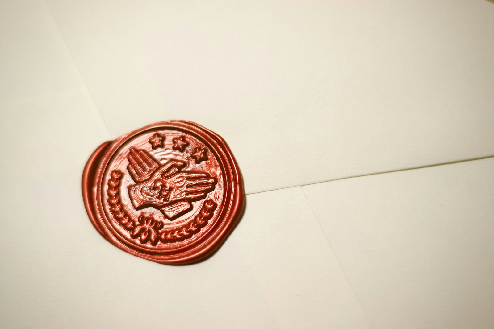 Red wax seal with an eagle emblem on official paper