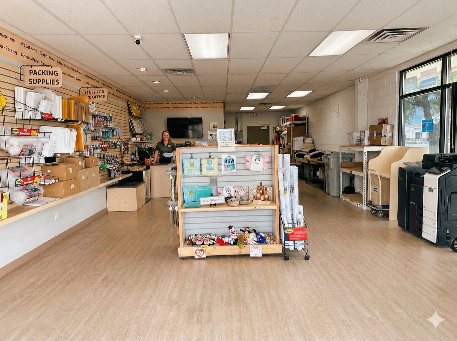 Inside the Postal Hub store, packing supplies wall and counter