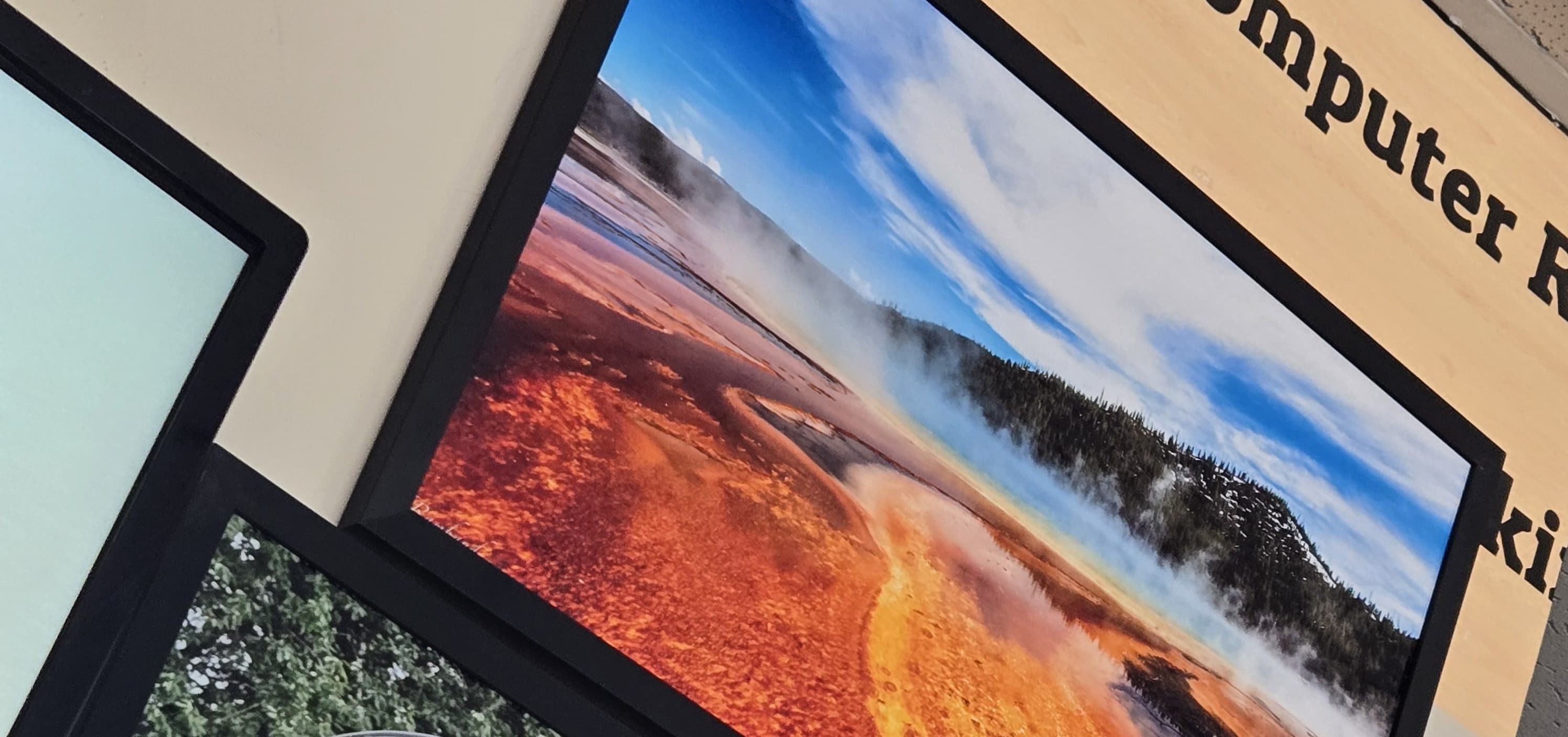 Framed sample photo prints on display at Postal Hub